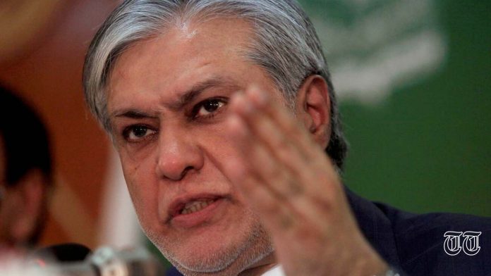 Senator Ishaq Dar is pictured addressing a press conference in 2017.