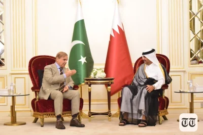 A file photo is shown of Shehbaz Sharif with Amir Qatar