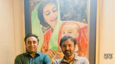 A file photo shows FM Bilawal Bhutto Zardari and PPP MNA Musa Gillani standing alongside a portrait of former PM Benazir Bhutto.