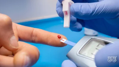 A file photo is shown of a blood test being carried out.