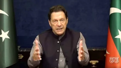 Imran Khan is shown addressing party workers via video-link. — PTI