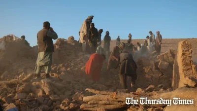 On October 7, 2023, residents of Sarbuland village in the Zendeh Jan district of Herat province, Afghanistan, are seen removing debris from a house impacted by the recent earthquake. — FILE/AFP