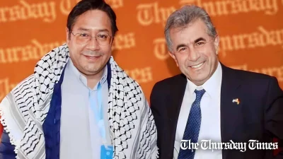 A file photo is shown of Bolivian president Luis Arce (L) with Palestinian ambassador to Bolivia Mahmoud Alwani (R). — FILE/THE THURSDAY TIMES