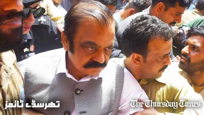 Senior PML(N) leader Rana Sanaullah is escorted to a Lahore court on July 2, 2019. — AFP