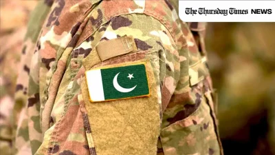 A file photo is shown of the Pakistan flag draped on an Army uniform. — FILE/THE THURSDAY TIMES