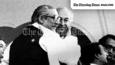 A file photo is shown of Bangabandhu Sheikh Mujib (L) with former Pakistani premier Zulfikar Ali Bhutto (R) in 1974. — AP