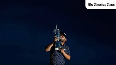 J. J. Spaun of the United States kisses the trophy after winning the 125th U.S. OPEN at Oakmont Country Club on June 15, 2025 in Oakmont, Pennsylvania. — Patrick Smith/Getty Images