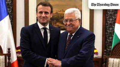 A file photo is shown of French President Emmanuel Macron and Palestinian President Mahmoud Abbas. — THE THURSDAY TIMES