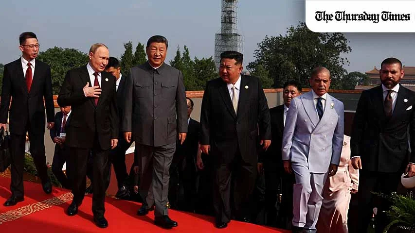 Russia's President Vladimir Putin walks with China's President Xi Jinping, North Korea's leader Kim Jong Un and Pakistan's Prime Minister Shehbaz Sharif before a military parade marking the 80th anniversary of victory over Japan and the end of World War II, in Beijing's Tiananmen Square on September 3, 2025. (Photo by Alexander KAZAKOV / POOL)