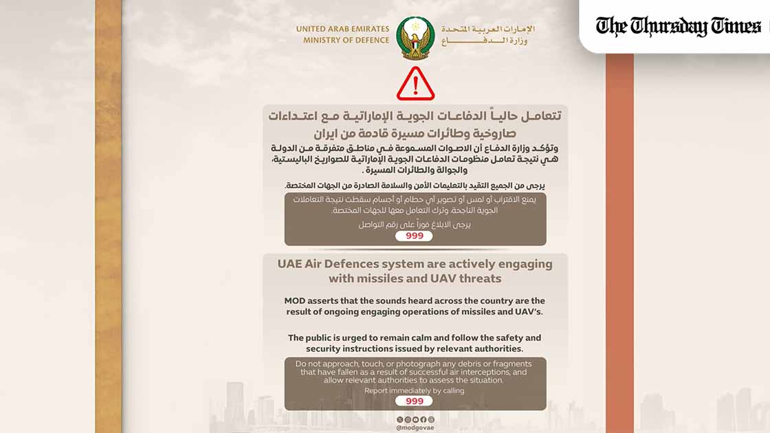 Official UAE Ministry of Defence public safety alert stating that air defence systems are engaging incoming missile and drone threats, with instructions for residents to remain calm, follow safety guidance, and avoid debris. — FILE/MOD UAE