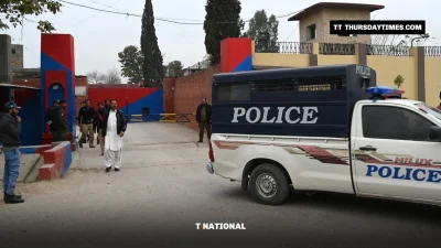 Police and a police van outside the entrance of Adiala Jail