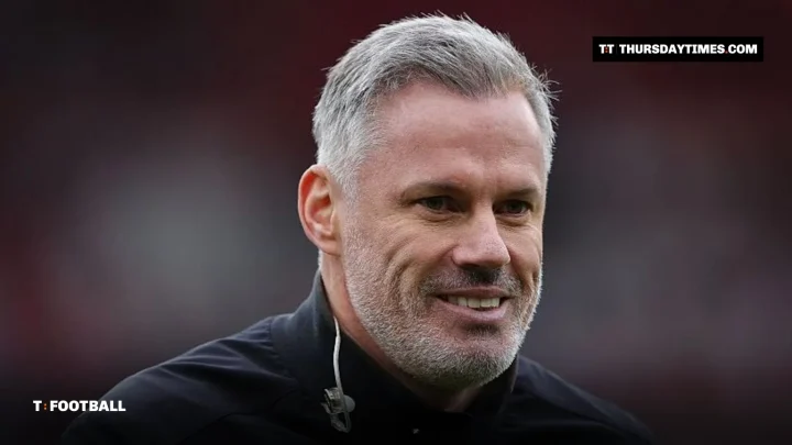 Jamie Carragher smiling pitchside