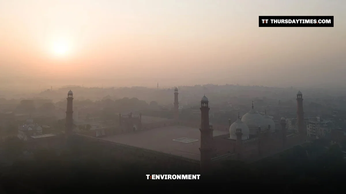 Aerial view of the Badshahi Mosque in Lahore shrouded in smog at sunrise