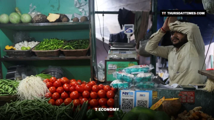 A vendor waits for customers at a vegetable shop in Mumbai, India, file photo. — REUTERS/FRANCIS MASCARENHAS