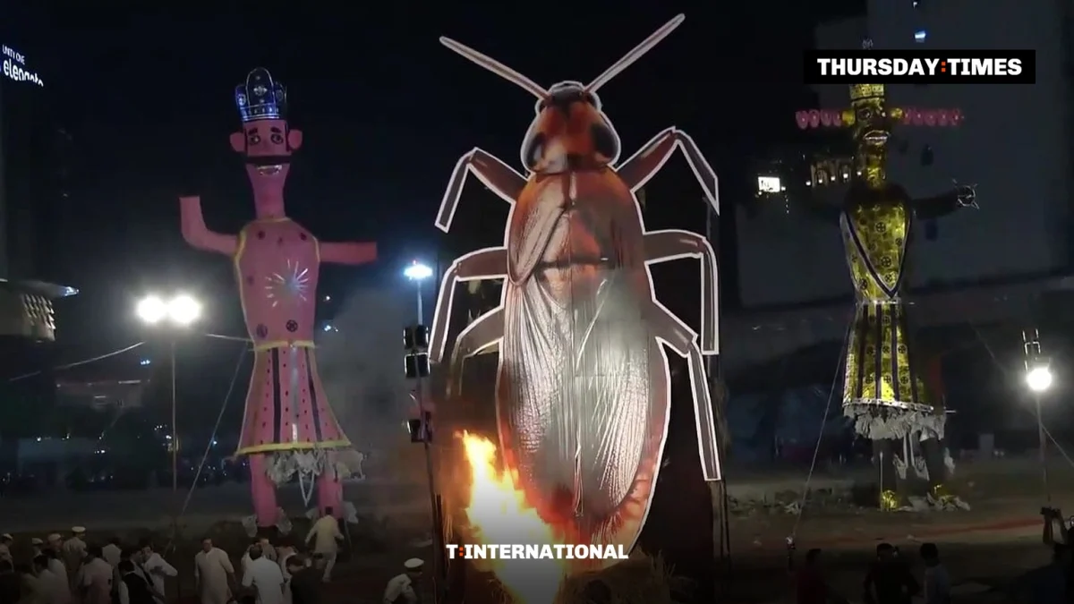 A 30-foot cockroach effigy is set alight between effigies of Kumbhakarna and Meghnad at a Dussehra event in Pitampura, Delhi. — FILE/THE THURSDAY TIMES