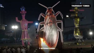 A 30-foot cockroach effigy is set alight between effigies of Kumbhakarna and Meghnad at a Dussehra event in Pitampura, Delhi. — FILE/THE THURSDAY TIMES