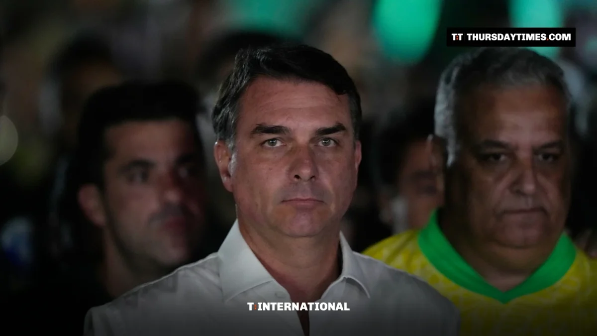 Flavio Bolsonaro walks with supporters on election night in Brasilia