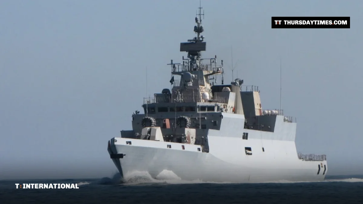 An Indian Navy grey stealth corvette sailing at speed