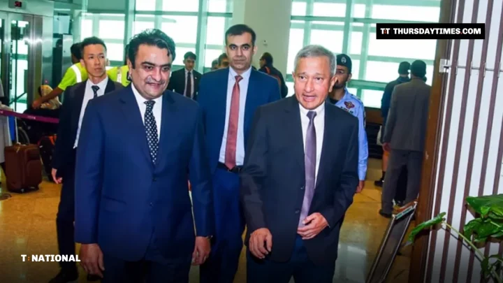 Singapore Foreign Minister Vivian Balakrishnan walks with Pakistani officials after arriving in Islamabad
