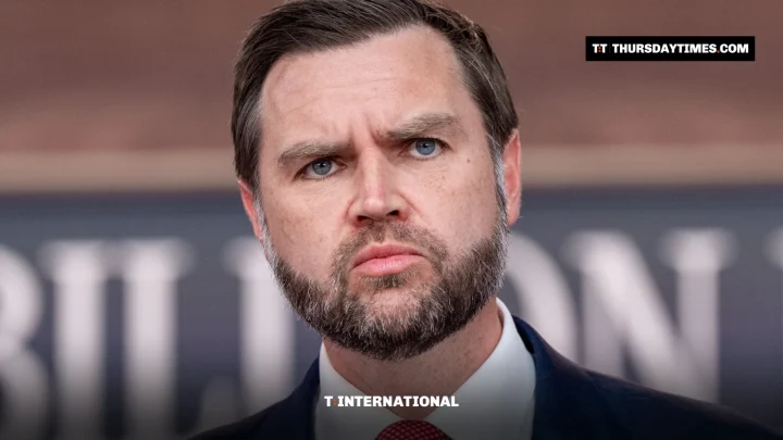 JD Vance looks ahead with a stern expression at a news conference