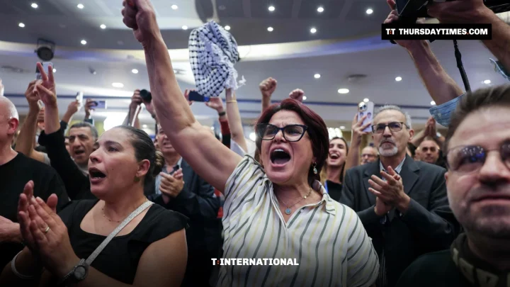 Joint List supporters cheer at the alliance headquarters in Nazareth