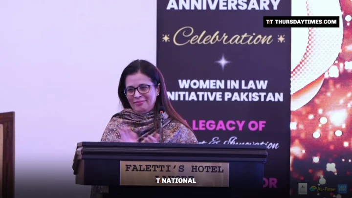 Justice Ayesha Malik speaks at a lectern in Lahore