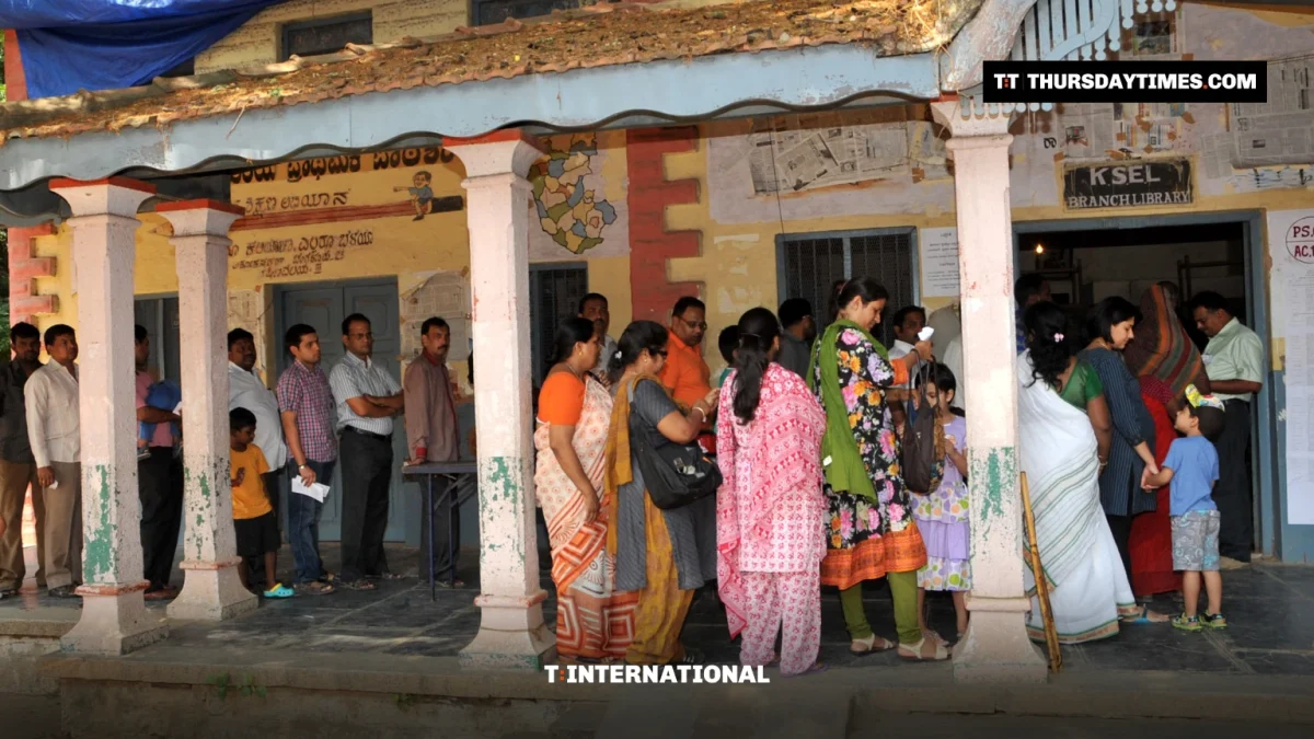 Men and women queue outside a polling station in Bengaluru