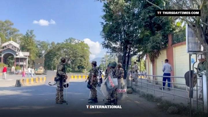 Security personnel stand guard on a road in Imphal, Manipur, amid curfew during the Naga-Kuki ethnic violence. — PTI
