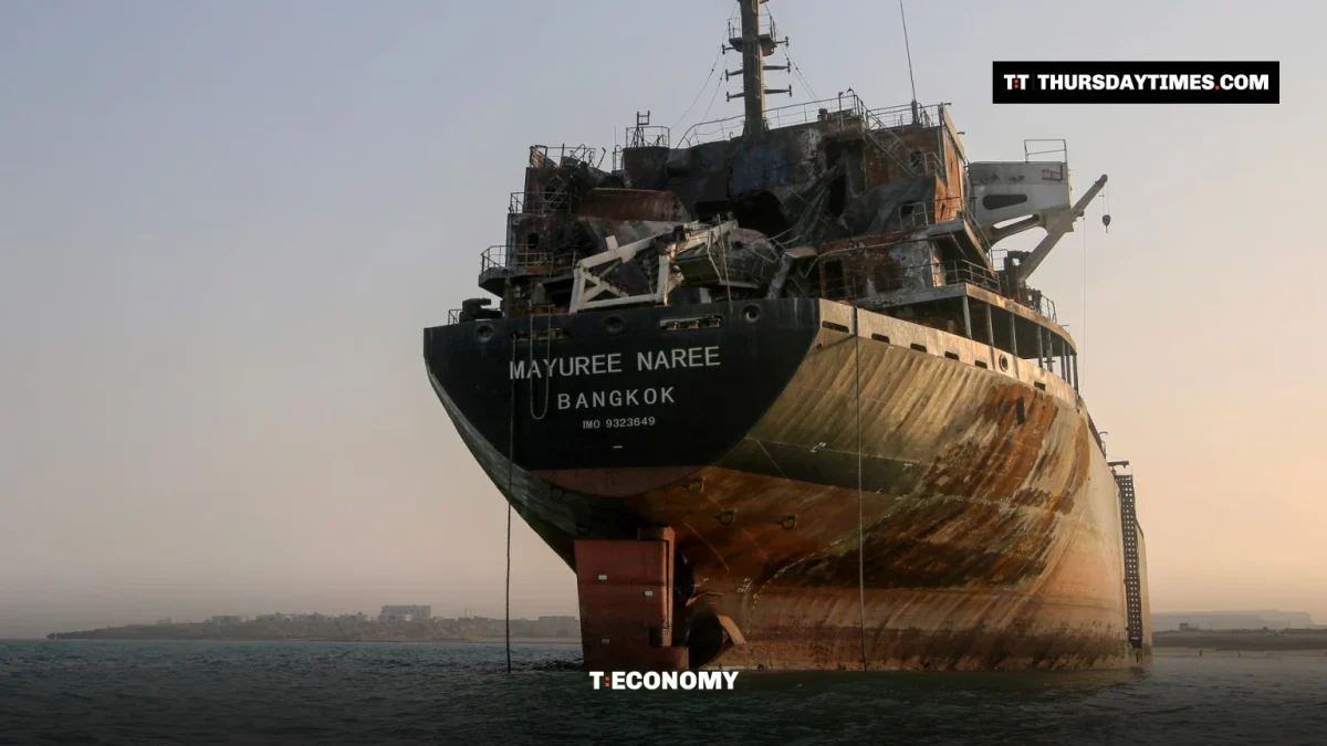 A burned-out bulk carrier sits stranded in shallow water off Qeshm Island