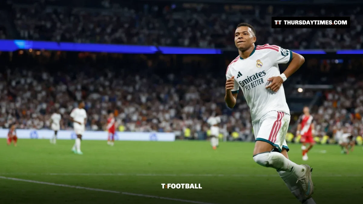 Kylian Mbappe runs in celebration at the Santiago Bernabeu