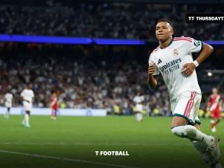 Kylian Mbappe runs in celebration at the Santiago Bernabeu