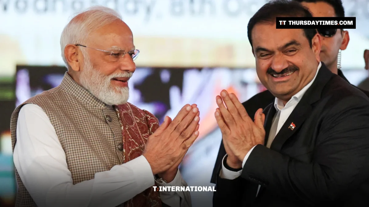 Narendra Modi and Gautam Adani greet each other with folded hands