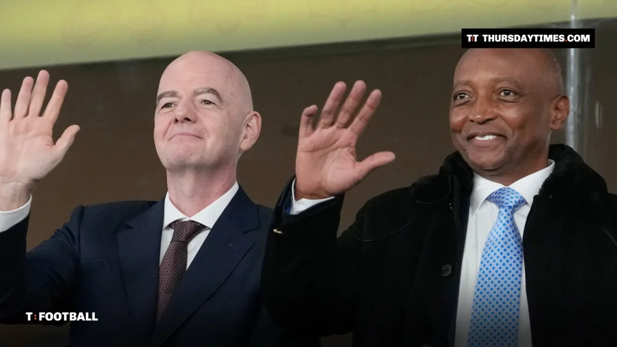 CAF president Patrice Motsepe and FIFA president Gianni Infantino wave from the stands