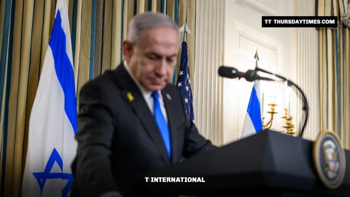 Benjamin Netanyahu at a lectern beside an Israeli flag