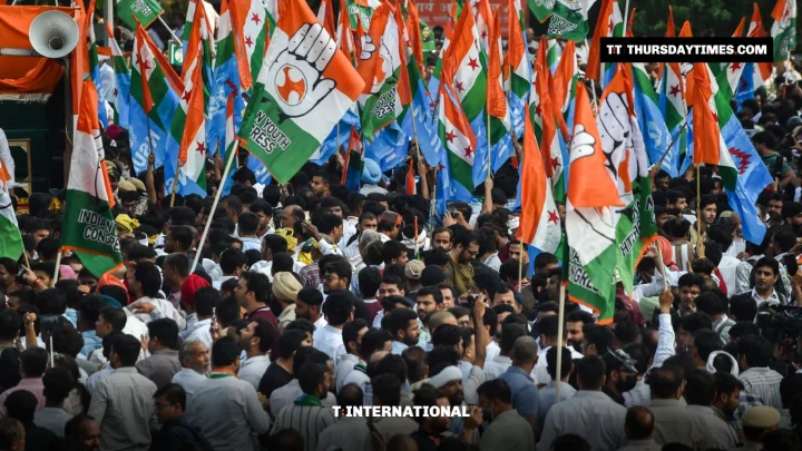 A large crowd waves Congress and opposition flags at a rally in New Delhi