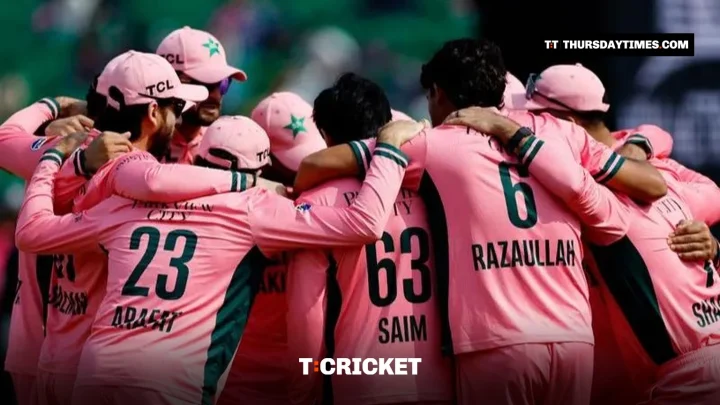 Pakistan players huddle in their pink kit before the tri-series match against England at the Gaddafi Stadium in Lahore on Sunday. — REUTERS