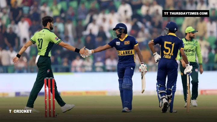 Shaheen Shah Afridi shakes hands with Kamindu Mendis in front of a packed crowd in Lahore