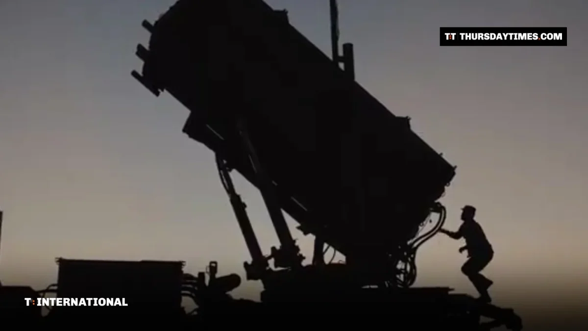 Silhouette of a soldier at a Patriot missile launcher at dusk