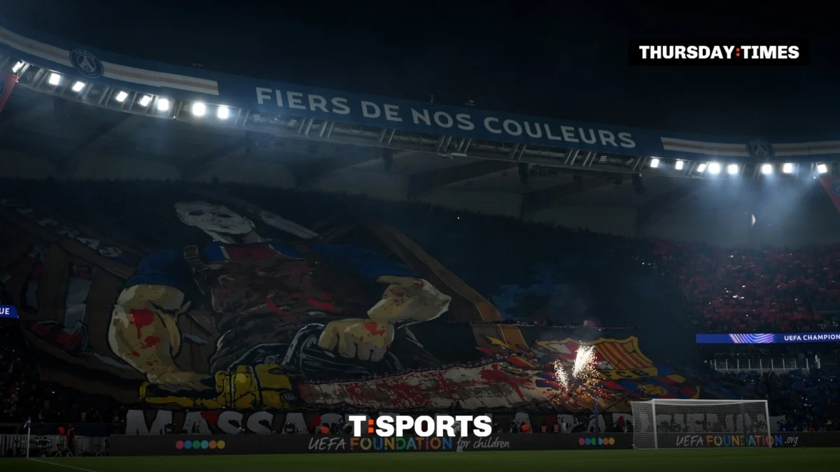 PSG fans display a tifo of a masked man taking a chainsaw to Barcelona’s crest before the Champions League match at the Parc des Princes. Photograph: David Ramos/UEFA via Getty Images