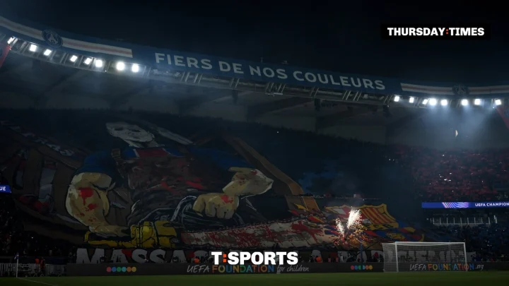 PSG fans display a tifo of a masked man taking a chainsaw to Barcelona’s crest before the Champions League match at the Parc des Princes. Photograph: David Ramos/UEFA via Getty Images
