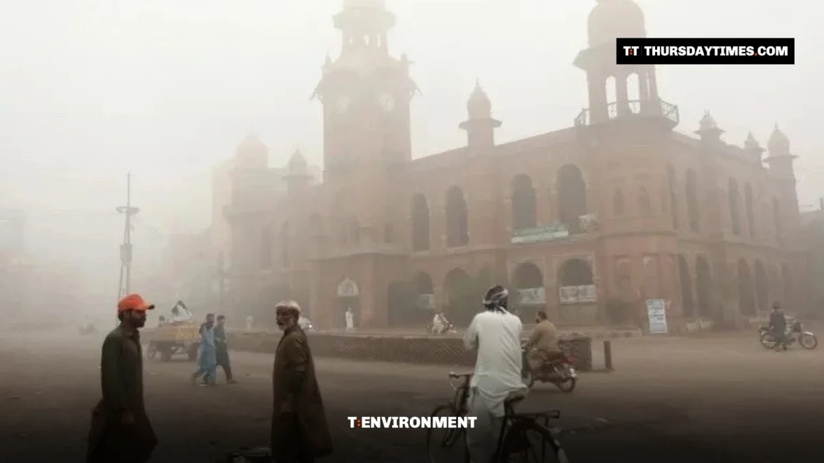 People gather on a smog-covered street in Punjab, file photo. — AFP