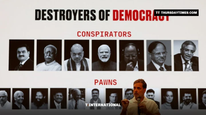 Rahul Gandhi speaks in front of a screen reading Destroyers of Democracy and Vote Chori