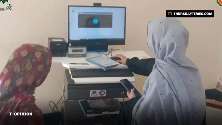 Two women at a telehealth computer station in a Balochistan health unit