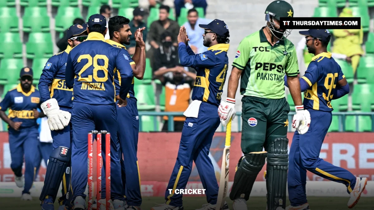 Sri Lankan players in blue celebrate as Fakhar Zaman in Pakistan green walks off