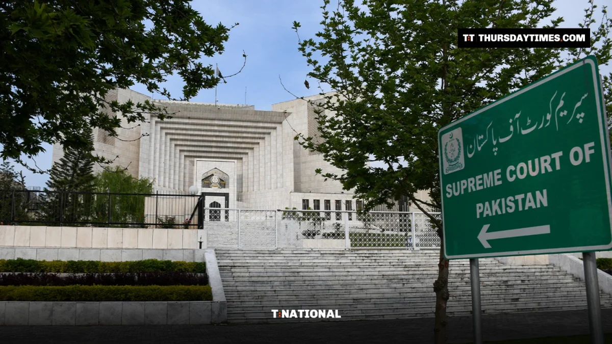 The Supreme Court of Pakistan building in Islamabad behind a green road sign