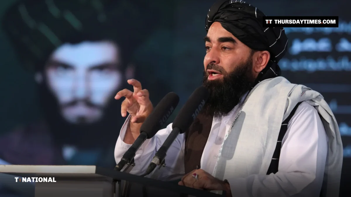 Zabihullah Mujahid speaking at a podium